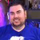 Jeff Gerstmann wearing a blue shirt and smiling.